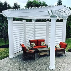 12x12 custom vinyl pergola with integrated privacy panels, professionally installed in the Niagara Region